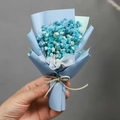 Detailed view of mini blue and white dried baby's breath bouquet with matte paper wrap - Blue White Gypsophila (Blue Wrapping)