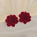 Macro detail of red floral velvet stud earrings on elegant white silk fabric background - No.94 Deep Red Flocking Layered Flower (XXX6745)