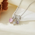 Close-up of silver necklace with pink heart, purple oval, and star charms on stone base - Silver Pink Zircon Heart Star Necklace (T021)