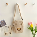 Beige corduroy crossbody bag with brown plush bear patch and adjustable strap - Khaki