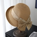 Elegant khaki woven straw sun hat with wide bow ribbon on a wooden stand display - Khaki (80468# Letter D)