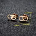 Minimalist interlocking hollow heart stud earrings in polished gold finish for women - 027 Double Heart / Rose Gold
