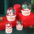 Set of four Christmas snow globes with Santa Claus base and assorted holiday figures - Santa Beard Base (45#) / Small Light & Snowfall Version