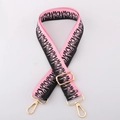 Detail of 38mm pink and black striped bag strap with flame pattern and gold metal hooks - Pink Black Flame / Gunmetal