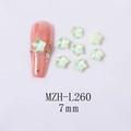 Detailed view of 7mm light green star-shaped iridescent nail crystals and application - 7-Point Star - Green Mocha (L260)