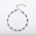 Minimalistisches Edelstahlarmband in Silber mit schwarz-weißen Evil Eye Anhängern und Verschluss - 17+5cm / Schwarz