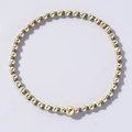 Handmade Bohemian beaded bracelet with gold and charcoal grey beads in minimalist style - Dark Grey and Gold