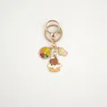 Detail of Capybara keychain featuring rainbow citrus, bear in dessert and pink cupcake charms - Dessert Bear With Orange Slice (Capybara#07)