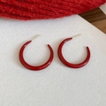 Detailed view of red enamel C-shaped hoop earrings on festive red and white fabric background - 3cm / Silver Earring Post - Red