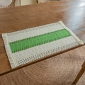 Handwoven boho dining placemat with green and beige diamond patterns and tassels - White Edges Green Middle