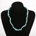Handmade turquoise chip stone necklace displayed on a black velvet mannequin bust - Blue/Turquoise