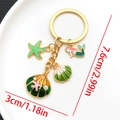Golden mermaid and starfish enamel keychain with size measurements 7.6cm and 3cm - Green Shell Starfish Keychain-LS558