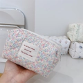 Detail of quilted cotton floral makeup bag with French label and premium metal zipper - Light Pink Purple Floral