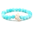 Elastic beaded bracelet with light blue turquoise beads and a white dolphin charm - Blue Stone