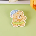 Cute cream-yellow acrylic bear badge in blue sleeping hat for bags and clothes - Dancing Bear