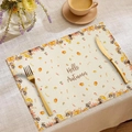 Fall placemat with raccoon and pumpkin print featuring Hello Autumn text on beige fabric - Beige Raccoon Hello Autumn
