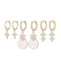 Detail of three pairs of gold earrings with star pendants and white zircon stones - Cross Star Flower Pink Zircon 3-Pair Set