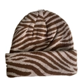 Detailed close-up of brown and beige animal print knitted beanie hat on white background - Zebra Stripes - Beige & Brown