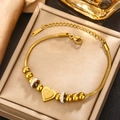 Detailed close-up of gold-plated stainless steel heart pendant on adjustable snake chain - Gold B-39 (Heart)