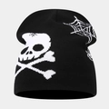 Macro view of knit beanie featuring white skull and crossbones with spider web patterns - Style E Black+White (Skull Spiderweb)