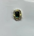 Golden stud earring featuring a rectangular emerald gemstone with halo crystal setting - Gold Edged Emerald Rectangle