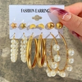 Set of 6 pairs of gold fashion earrings with pearls, stars, and moon studs on white card - Gold 6-Pair Set - Star Moon Geometric Pearl