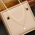Detailed view of gold multi-layer star necklace with black and white pendant charms - Black White Star Pendant Double Layer (4#)