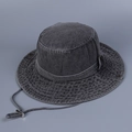 Detailed macro view of dark grey washed denim bucket hat with adjustable windproof cord - 56-58cm / Black