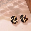 Retro square gold earrings with black enamel and rippled texture in light shadows - Black