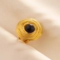 Close-up of vintage gold ring with black marble stone and spiral texture on fabric - Gold Base-Black Stone