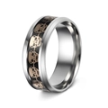 Macro side view of silver punk ring with black enamel and golden skull patterns - US 6 / Black Gold