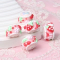 Detailed close-up of handmade strawberry cake resin beads for DIY jewelry making - Red Cherry + Pink Flower + Strawberry