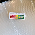 Gold-plated social battery brooch with a sliding lightning bolt showing mood levels - White - My Social Battery Slider Style