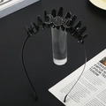 Macro view of gothic crown with black crystals and crescent moon symbols on metal band - Black Crystal + Black Wire Black Headband