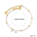 Stainless steel freshwater pearl bracelet with gold beads on a clean white background - Pearl and Gold Bead Bracelet