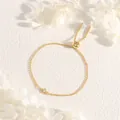 Macro detail of adjustable gold chain bracelet with a square clear zircon stone - Gold With Square Clear Zirconia