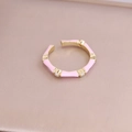 Detailed macro view of pink enamel bamboo ring with gold accents and sparkling stones - Adjustable Open / Pink