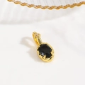 Macro shot of gold-plated turtle pendant with black oval gemstone and clear crystal - Black (Oval Style)
