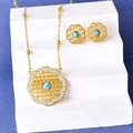 Vintage gouden kettingset met turquoise steen en hol bloemontwerp op blauwe basis - Set 3