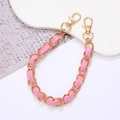Elegante gouden metalen ketting met roze leer verweven en dubbele kreeftsluitingen - Handketting / Roze