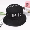 Close-up of black bucket hat featuring white graffiti lettering with a street style vibe - One Size / Black