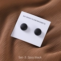 Detail of two black no-snag hijab magnets on white card over brown textured fabric - Black (SET-3)