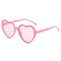 Chic heart-shaped sunglasses in all-pink colorway with a 45-degree angle side view - Pink Frame Pink Lens