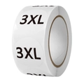 Close-up of round white adhesive clothing size labels with 3XL text on a roll - 3XL