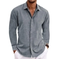 Detailed macro view of the grey linen texture and button cuff on a men's casual shirt - Gray