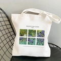 White Van Gogh Irises print canvas tote bag resting on a black metal chair - Irises (STD525-G)