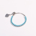 Detail of silver chain bracelet featuring sky blue round stones and a heart charm - Adjustable Open / Sky Blue Zircon - Platinum Silver