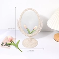 European style vintage cream makeup mirror with ornate floral carving details on white desk - Beige-Oval
