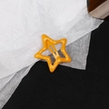 Vibrant bright yellow star-shaped snap hair clip in minimalist y2k candy color style - Orange