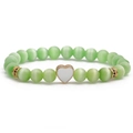 Light green cat eye beaded bracelet with a white heart charm and gold-plated details - White